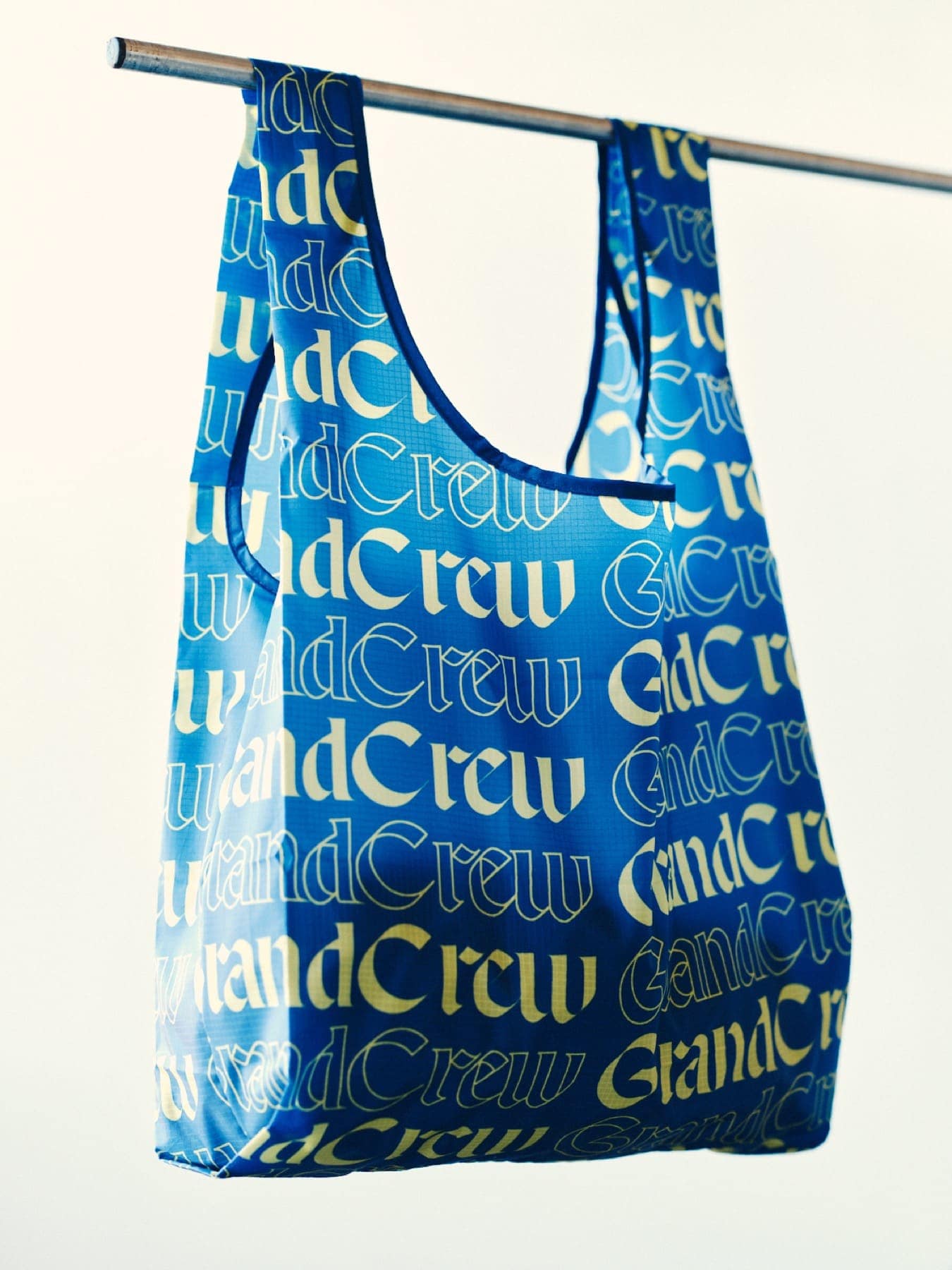 The tote bag hanging from a rail