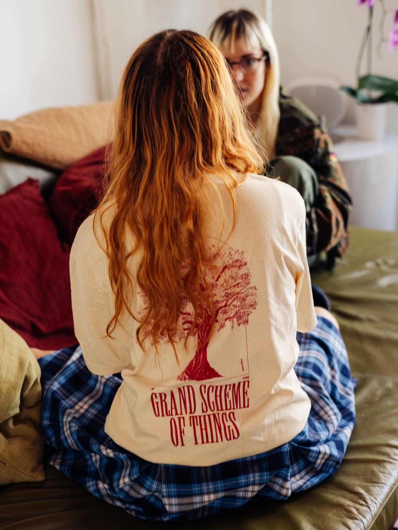 The Grand Scheme long sleeve from behind, red hair over the print