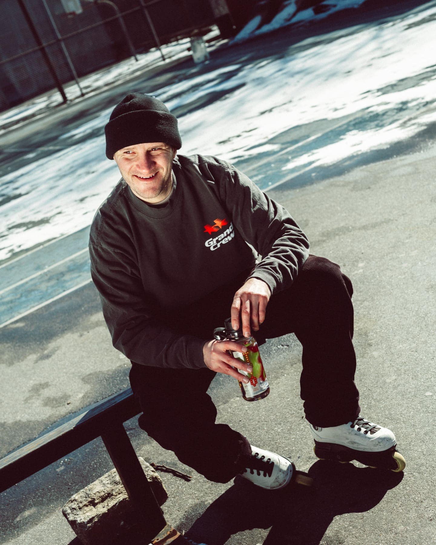 Sitting on a bench with the bottle, in snow light