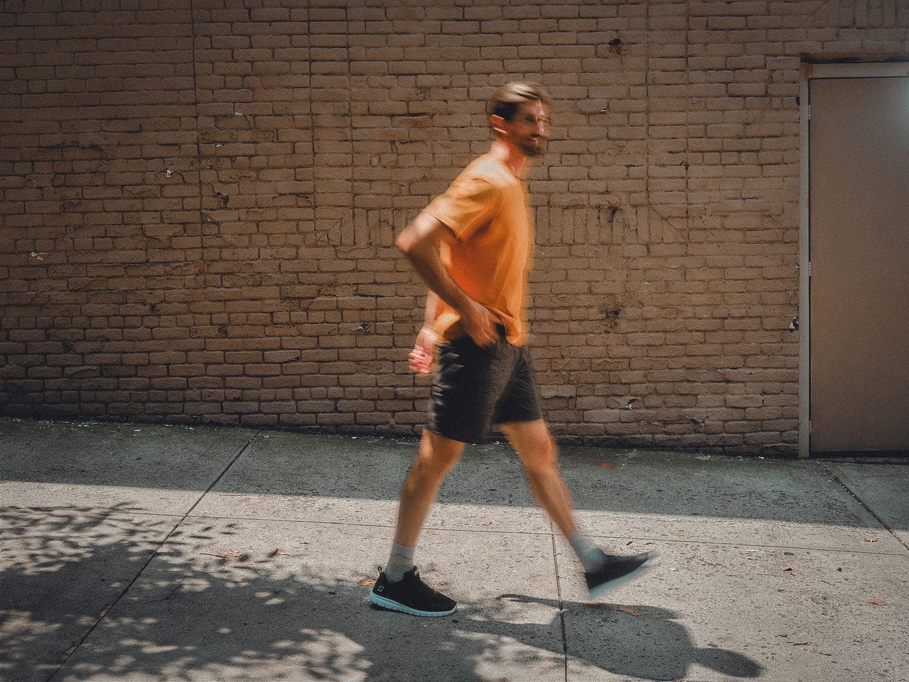 A man walking a city street